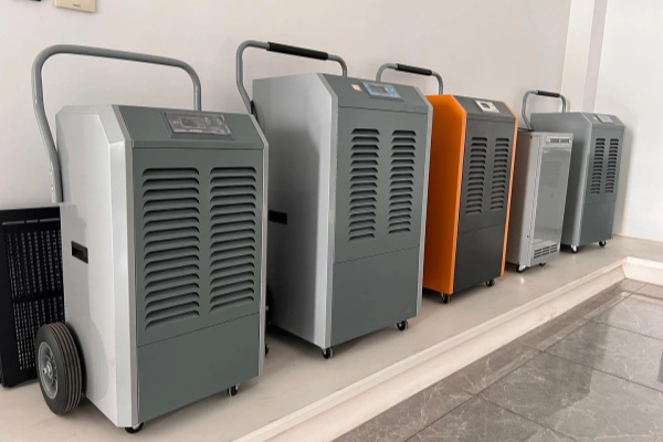 Large commercial portable dehumidifiers lined up for an article about how long dehumidifiers last
