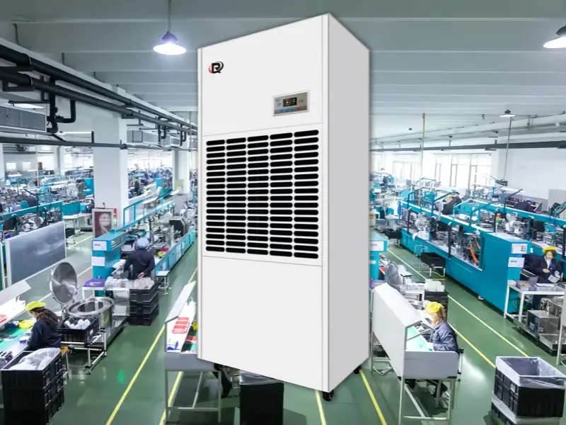 A large, white industrial dehumidifier in an electronics manufacturing facility.