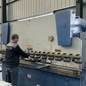 A technician operates machinery inside the Ruiwang Manufacturing facility.