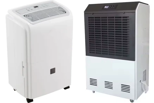 White residential standard dehumidifier on the left facing an industrial dehumidifier on the right, for comparison