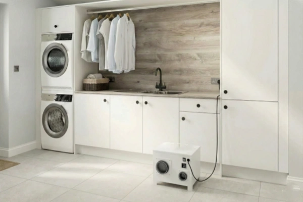 Laundry room application using rotary desiccant dehumidifier to maintain dry indoor air